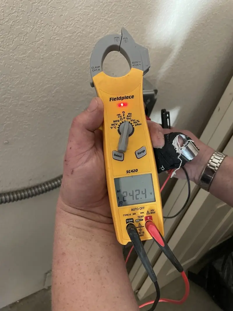 Voltage testing with clamp meter during Aluminum Wiring Replacement in Boston